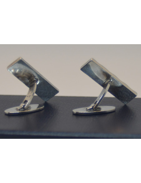 Manchetknapper i sølv.